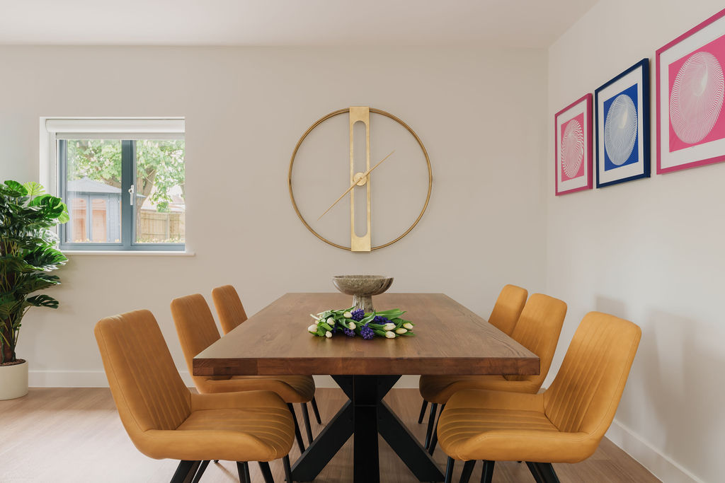 Dining room with walnut table and ochre velvet chairs